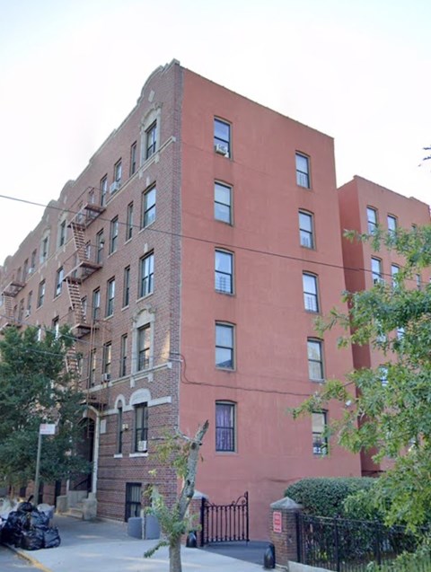 a large brick building with windows on the side of it