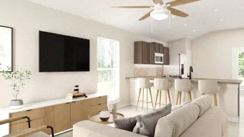 a living room with a couch and a kitchen