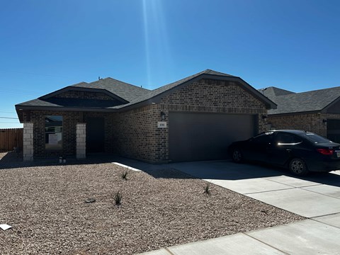 a house with a car parked in front of it