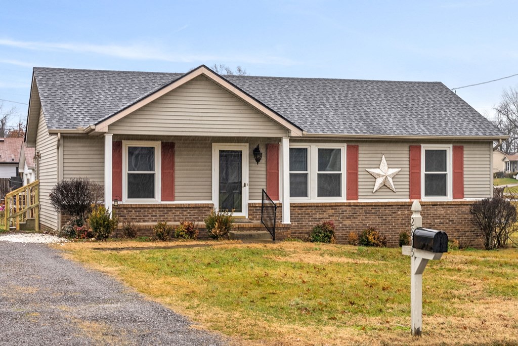 a tan house with a white star on the side of it