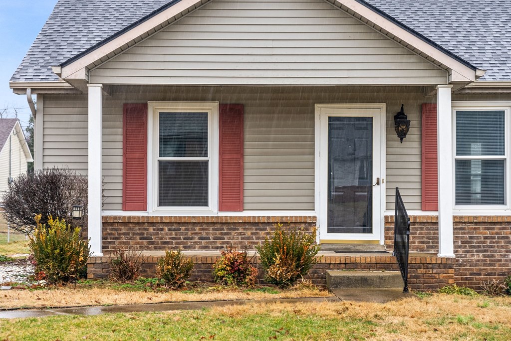 a home with a front porch and a blue door