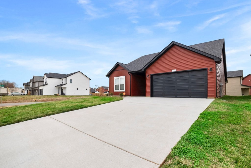a house with a driveway and a garage door