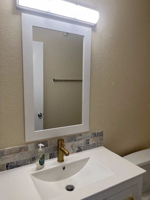 a bathroom with a white sink and a mirror