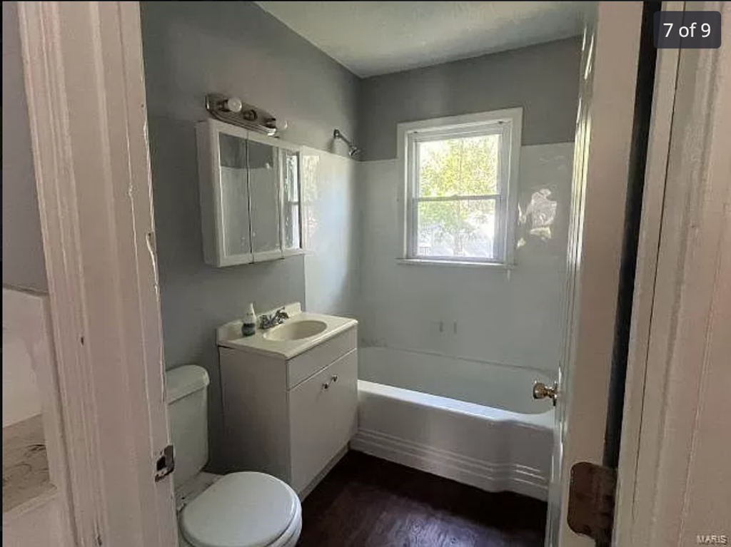 a bathroom with a sink toilet and a bath tub