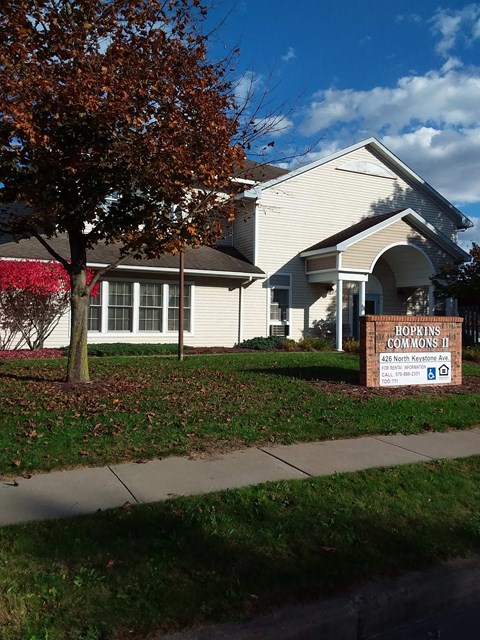 a house with a church sign in front of it