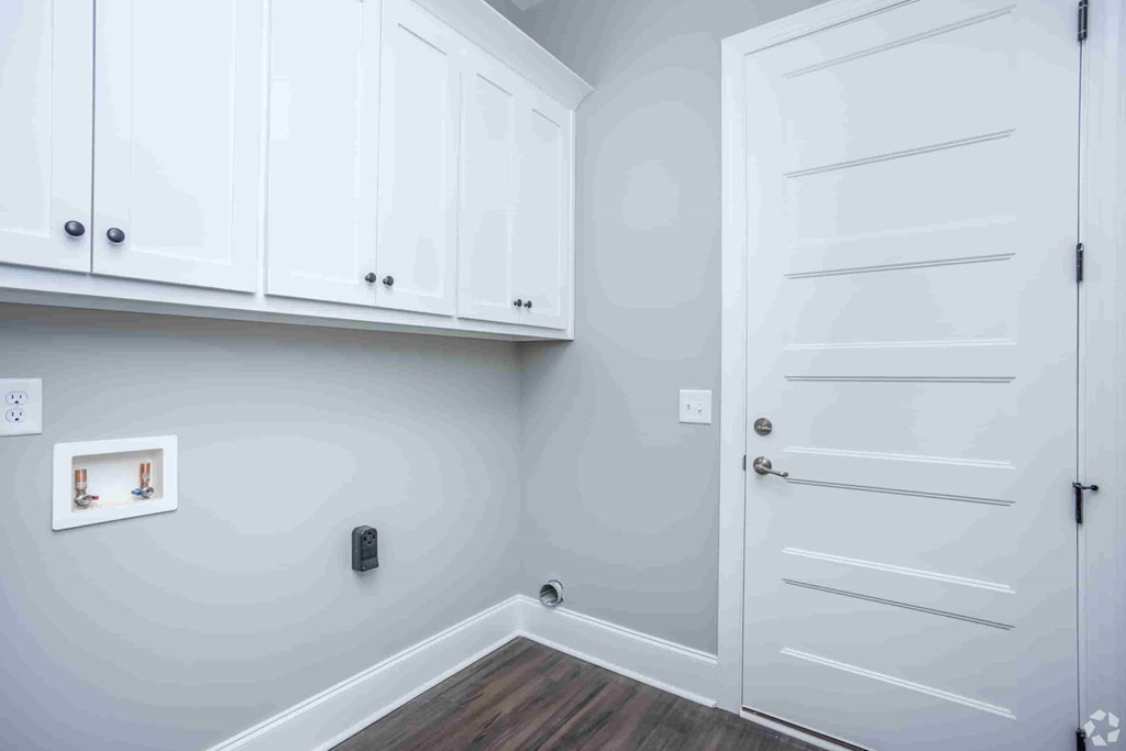 A white door is on the right side of the image.