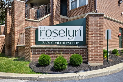 the sign in front of the roselij apartments building