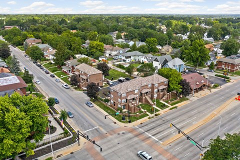 an aerial view of a neighborhood with a street and houses