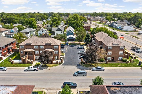 an aerial view of a neighborhood with houses and a street