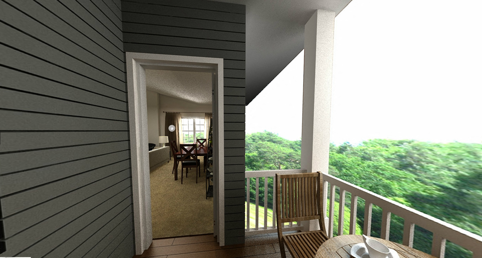 a view of the dining room and living room from the balcony