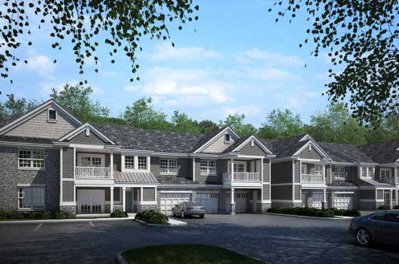 an apartment building with cars parked in front of it