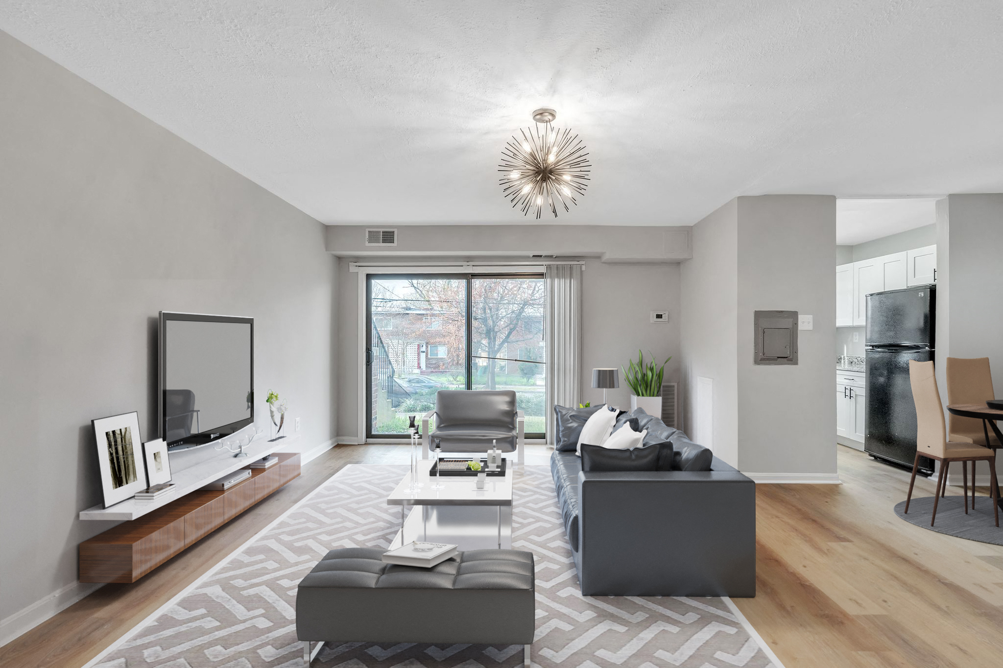 a living room with couches and a coffee table and a television
