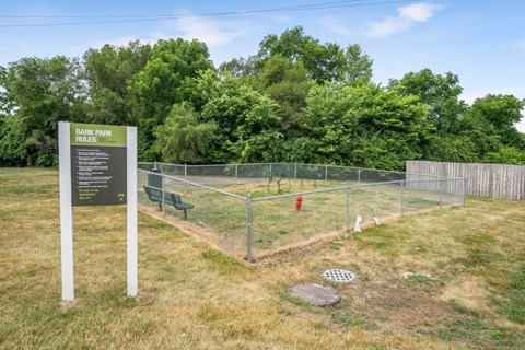 A sign in a park lists the rules for the park.
