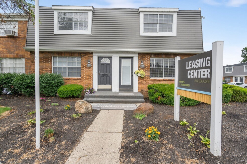 A house with a sign that says Leasing Center.