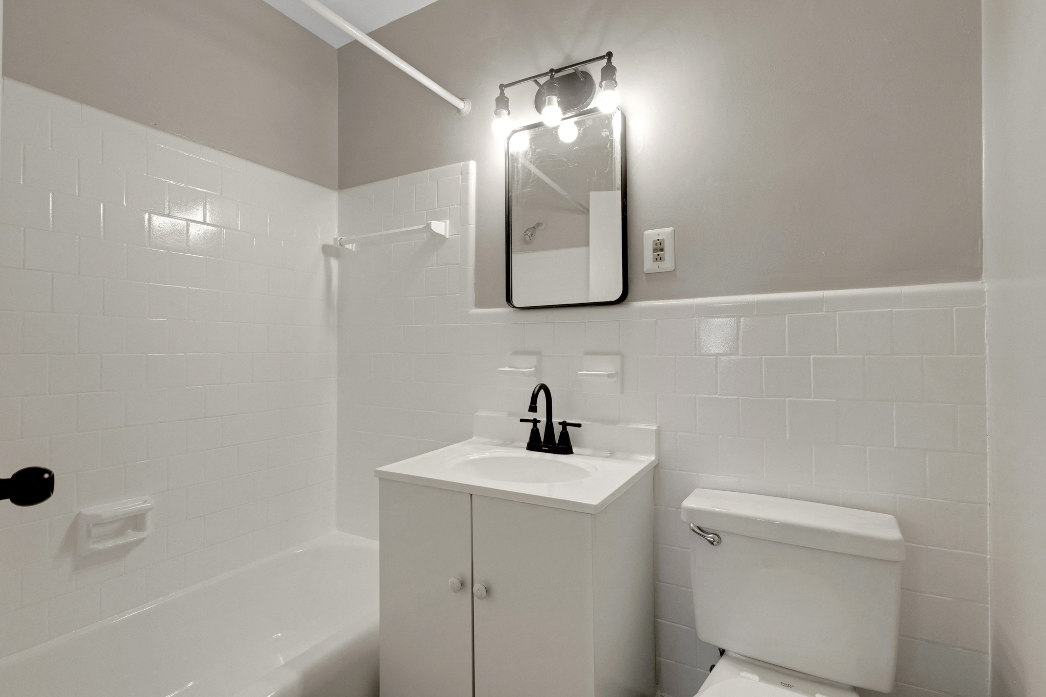 a bathroom with a sink and a toilet and a mirror