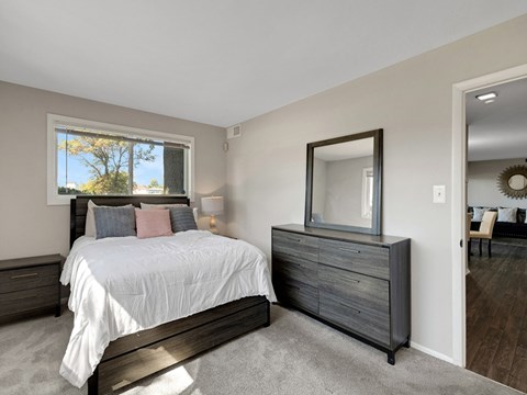 the retreat guest bedroom with bed and tv