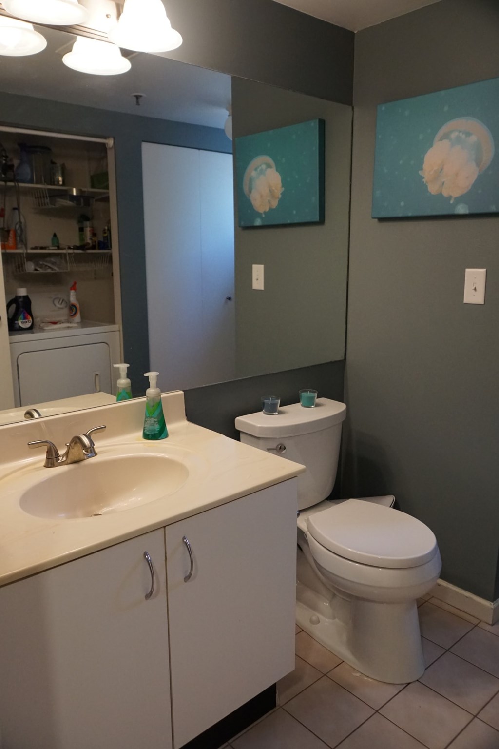 A bathroom with a white toilet and a white sink.