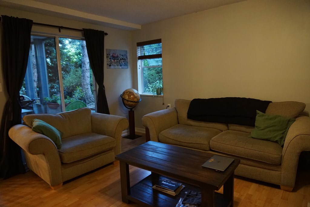 A living room with two couches and a coffee table.