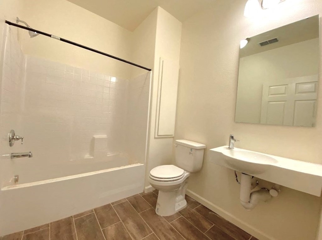 a bathroom with a toilet and a sink