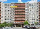 an image of a building with a yellow sign on top of it