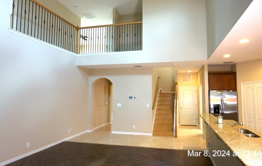 a view of the living room and kitchen of a new home