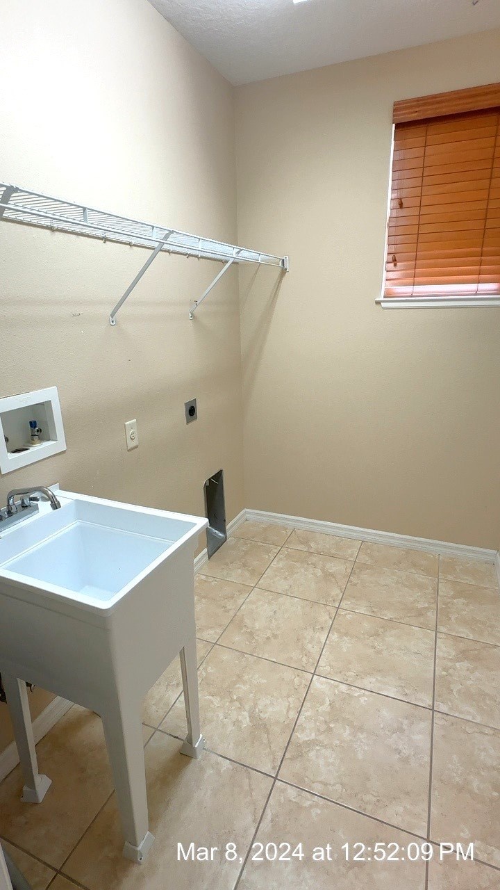 a bathroom with a sink and a shower and a window