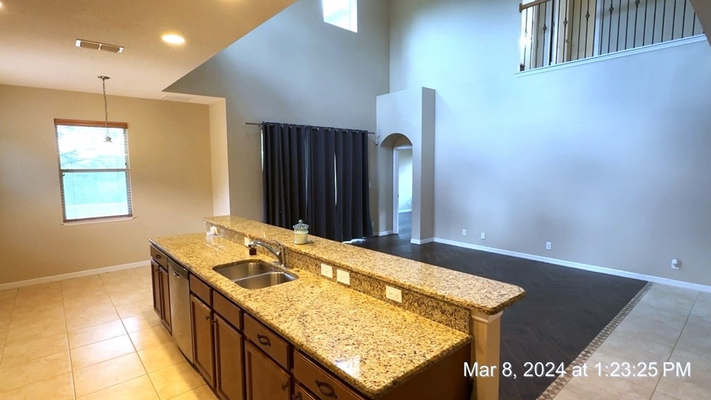 a kitchen with a sink and a counter top in a house