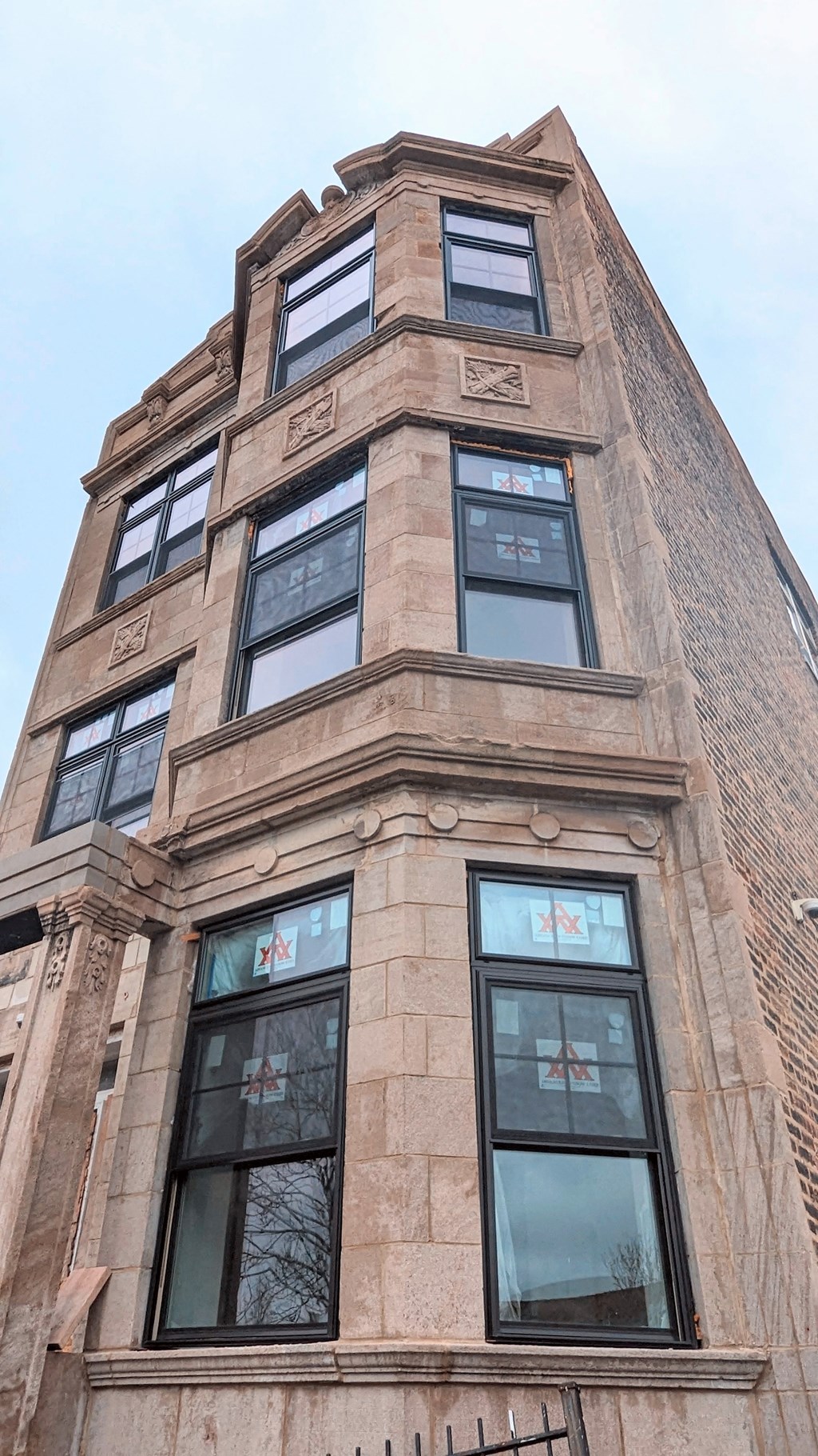 the top of a tall building with many windows