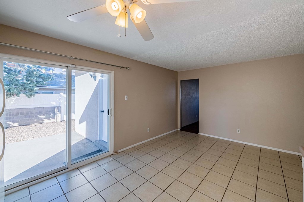 the living room has a sliding glass door to the patio