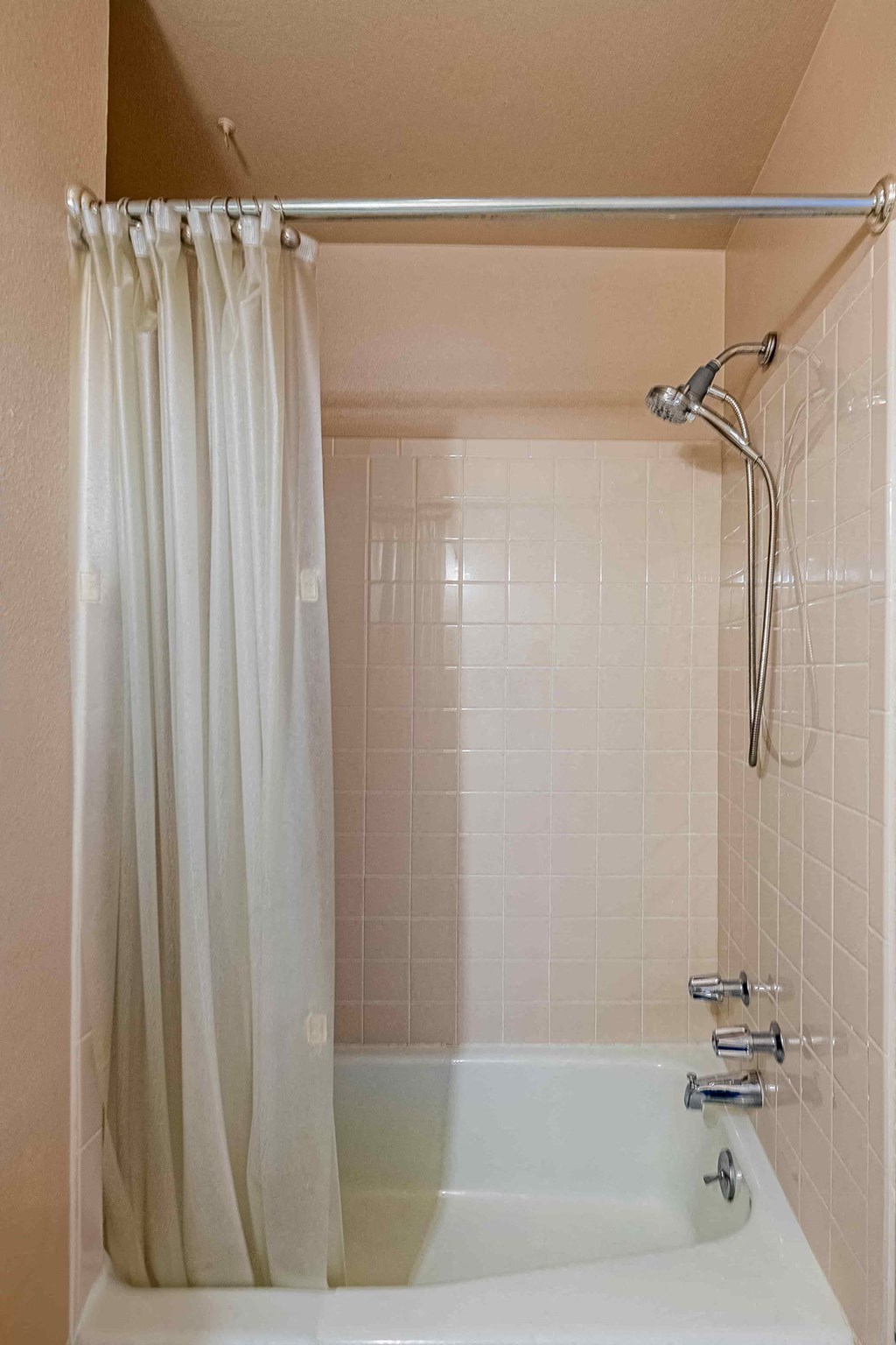 a bathroom with a shower and a bath tub