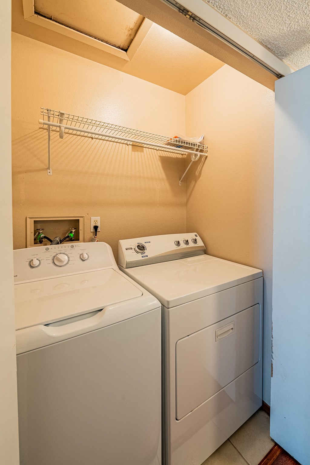 the washer and dryer in the laundry room of a home