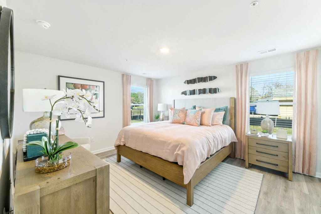 a bedroom with a bed and a dresser