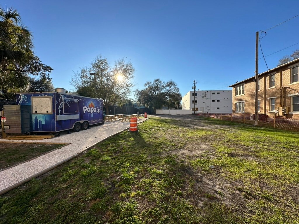 a blue truck parked on the side of a street