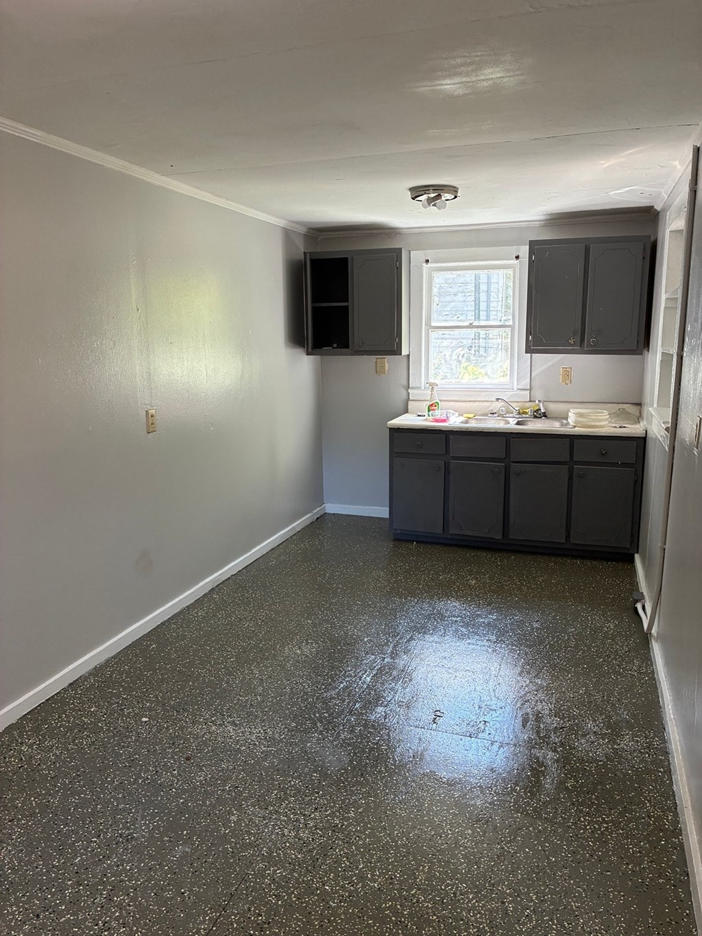 A kitchen with a counter and cabinets.