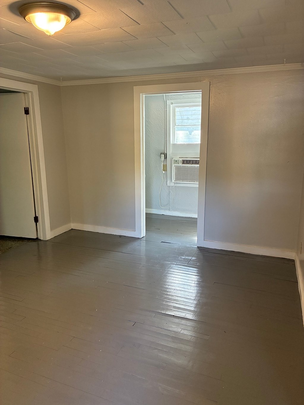 A room with a door and a window.