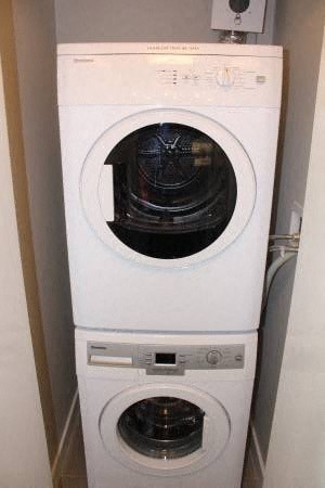 a white washing machine in a small room