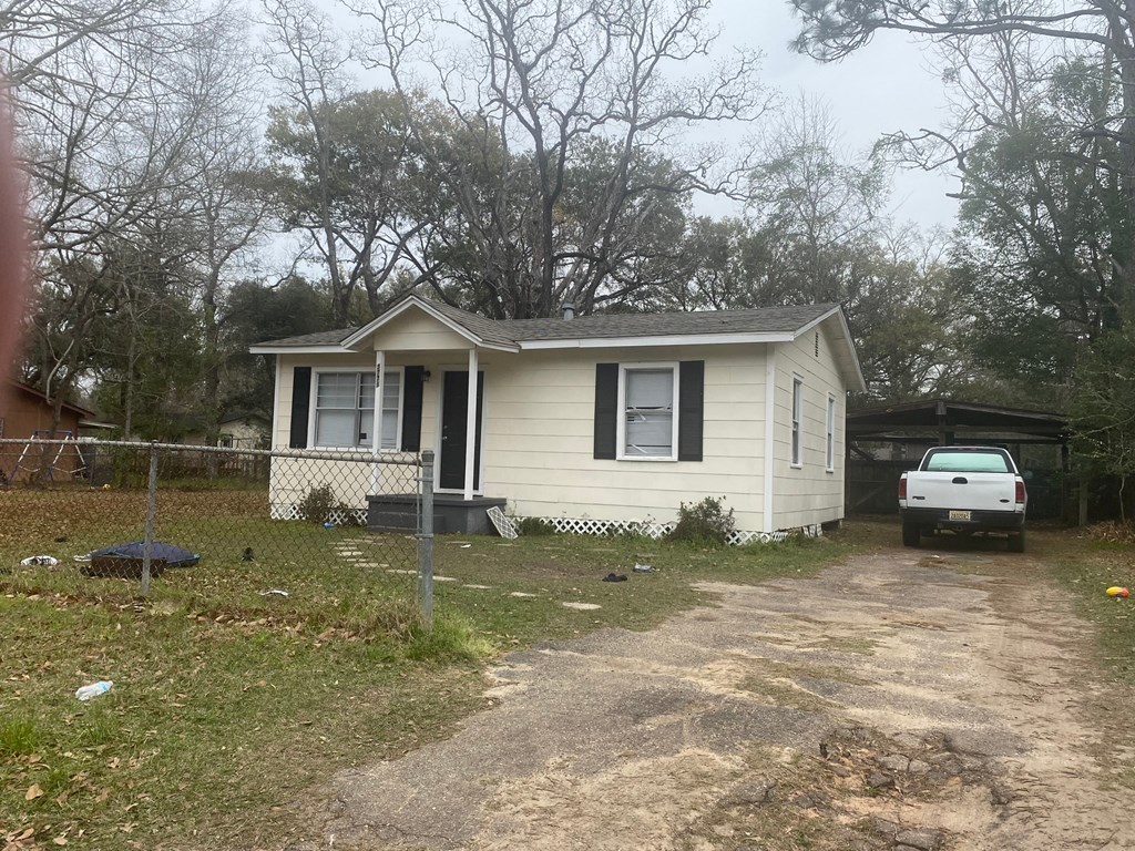 a small house with a white truck parked outside of it