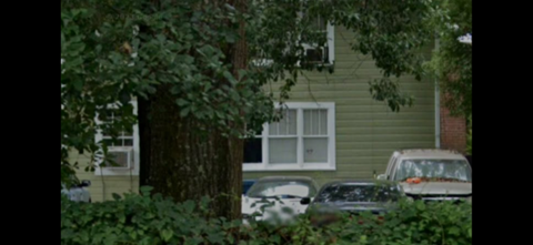 a house with cars parked in front of it