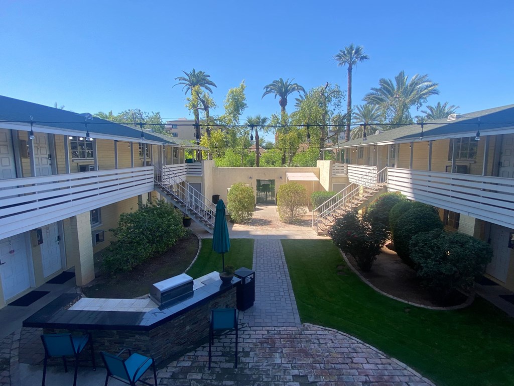 a view of the courtyard of an apartment building