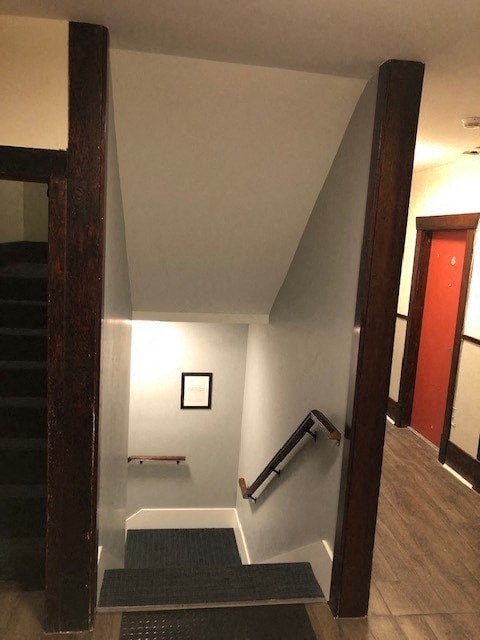 a stairway with a railing and a stair case