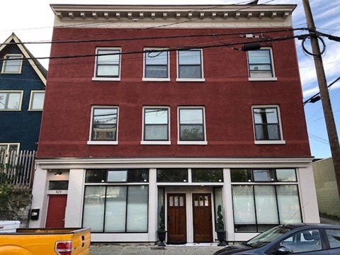 a red building with windows on the front of it