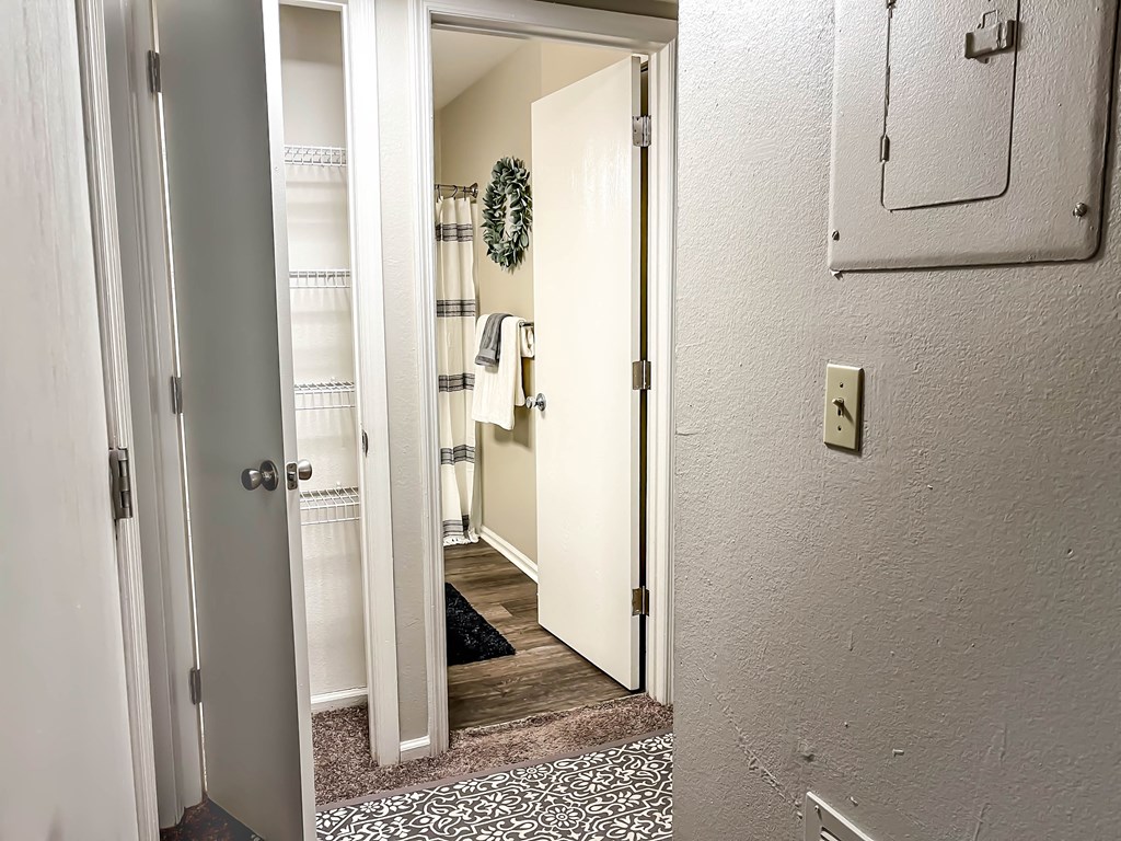 a bathroom with a mirror and a closet