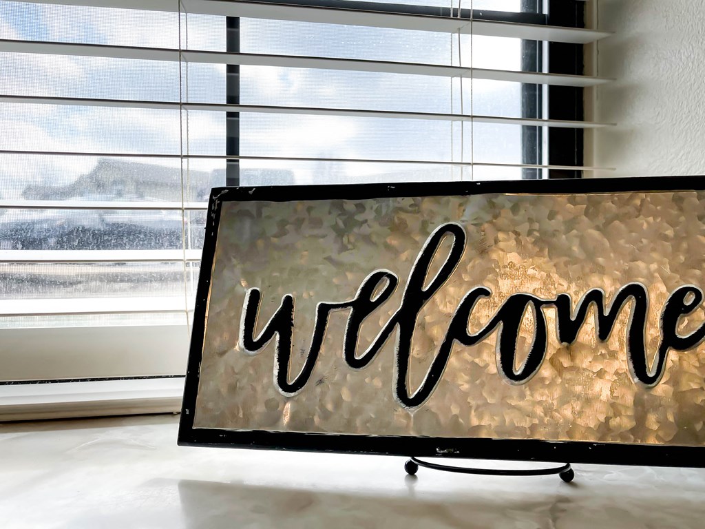 a sign that reads wifi in front of a window