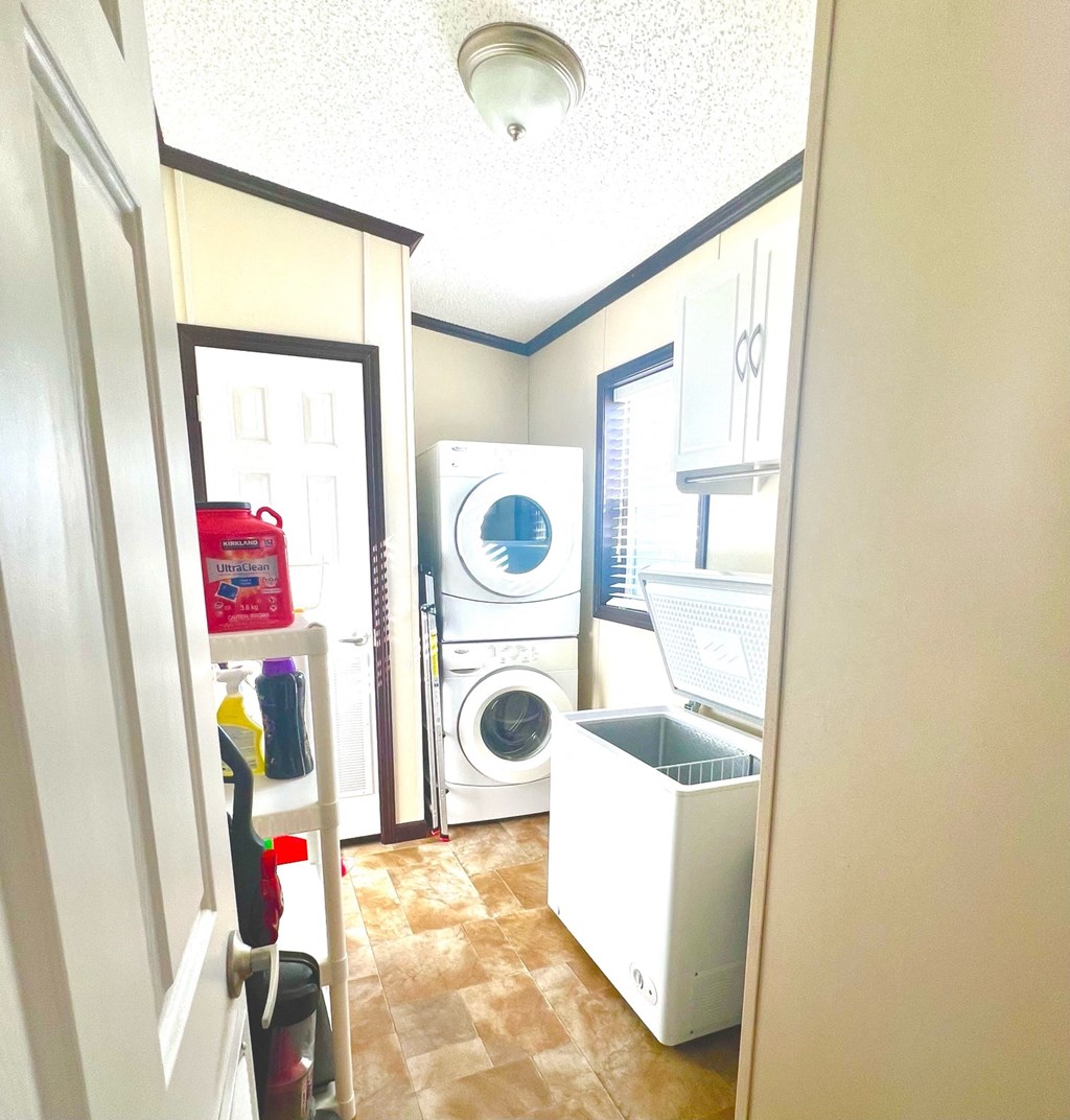 a small laundry room with a washing machine and a dryer