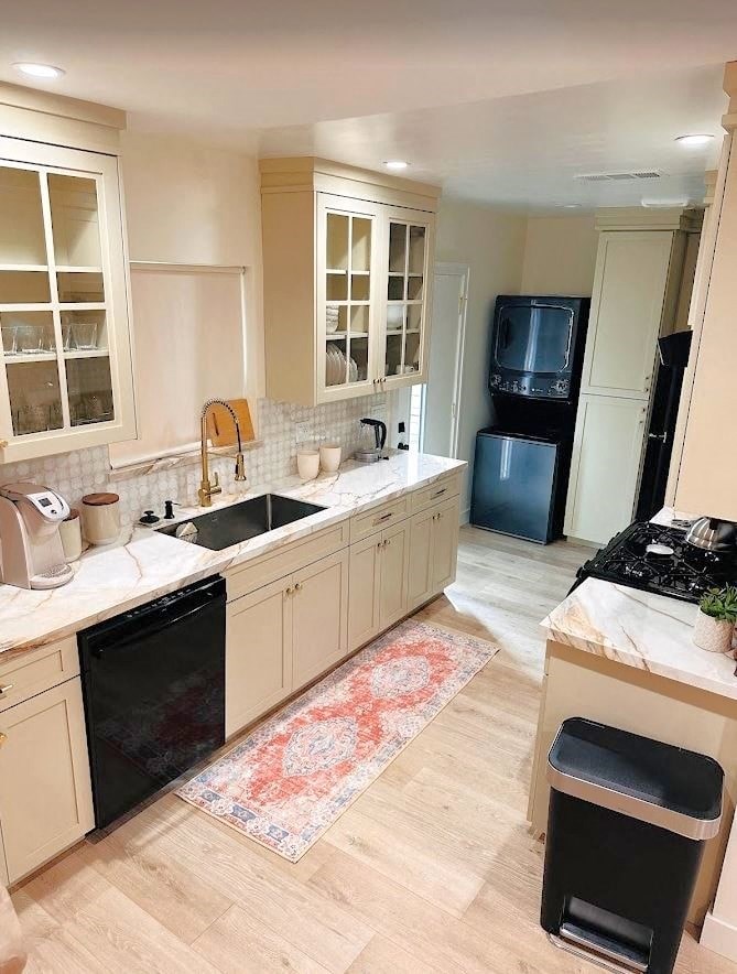 a kitchen with a sink and a refrigerator