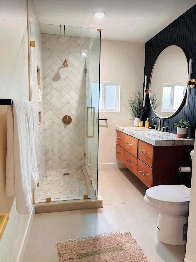 a bathroom with a shower and a sink and a toilet