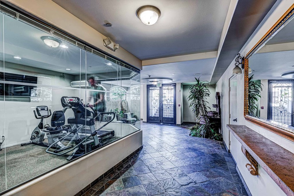a dentist office with a mirror and a chair in the window