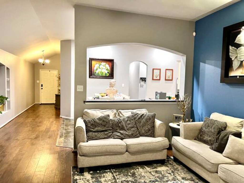 a living room with a blue wall and a couch