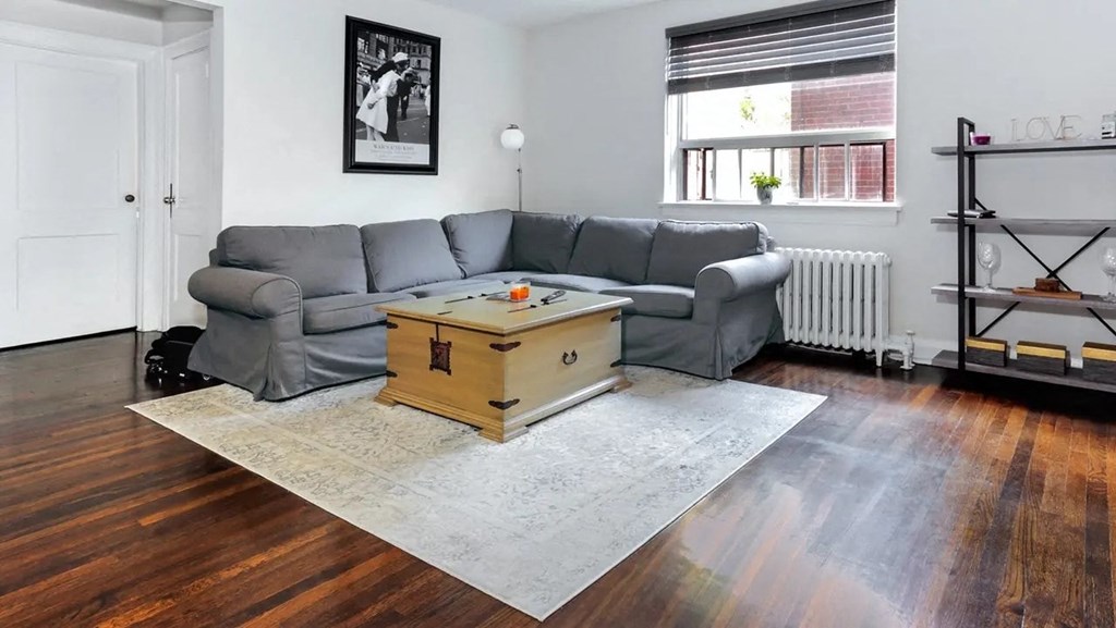 a living room with a couch and a coffee table in the middle