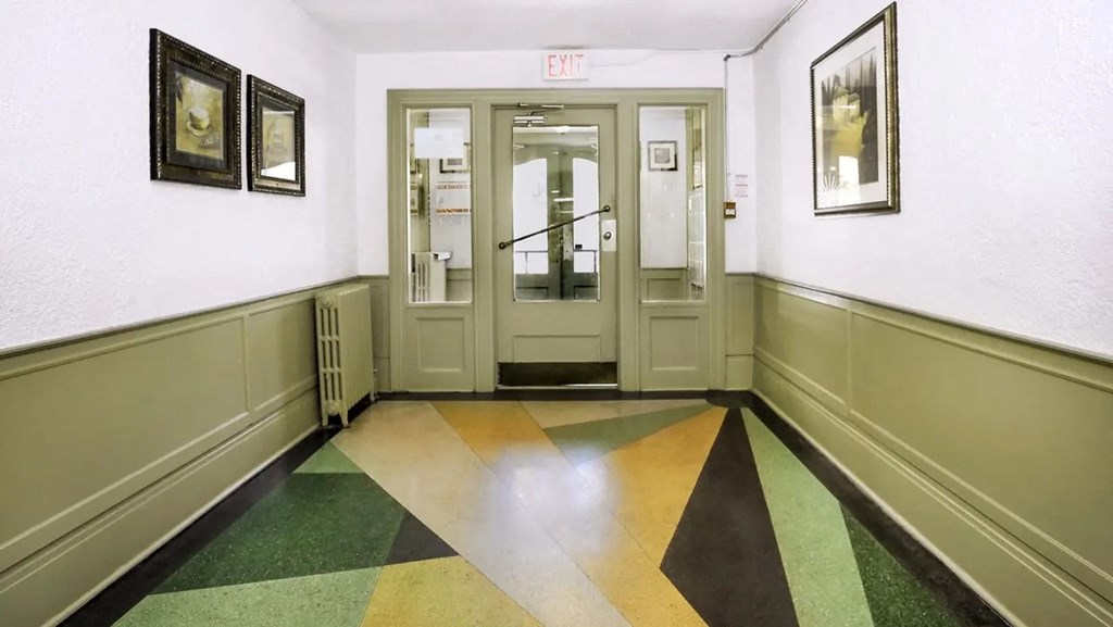 the entrance to a lobby of a building with doors